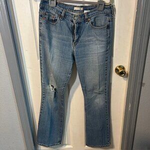 Levi’s 515 Bootcut Jeans Size 12M Medium Wash Distressed Knee Hole Well Worn